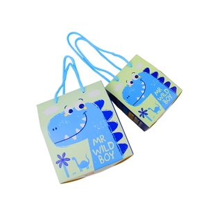 Green dinosaur party candy box with blue rope handle and Mr Wild Boy design