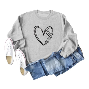 Close-up of heart and math print on grey long sleeve crewneck sweatshirt flat lay