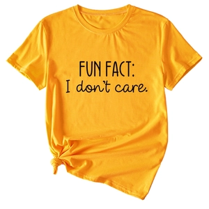 Detail of yellow cotton tee featuring black 'I don't care' text and side knot design