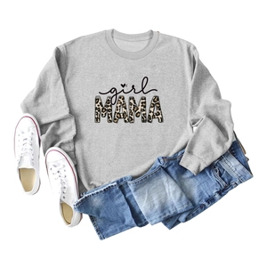 Detail of grey crewneck sweatshirt featuring girl MAMA leopard print graphic and cotton texture