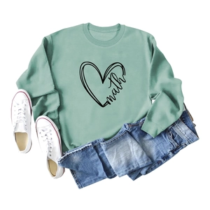 Sage green long sleeve crewneck sweatshirt with heart math print and casual blue jeans