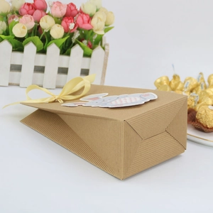 Easter bunny kraft paper gift bag with yellow ribbon bow and rabbit sticker decoration