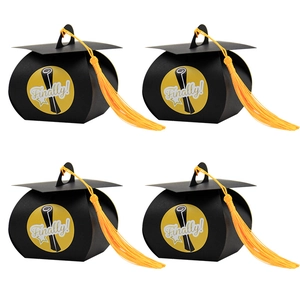 Graduation cap gift boxes with gold tassels and Finally! stickers for student parties