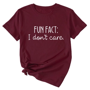 Detail of dark red cotton T-shirt featuring 'FUN FACT: I don't care.' text with a front knot