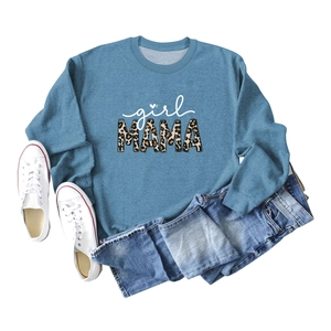 Flat lay of casual blue sweatshirt with girl MAMA leopard print and denim shorts