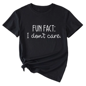 Detail of black T-shirt featuring Fun Fact I Don't Care slogan and knotted hem design