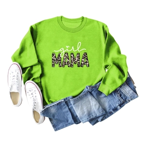 Flat lay of neon green girl mama sweatshirt with leopard print text and blue jeans