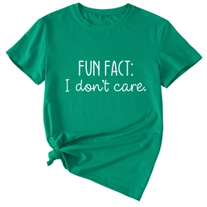 Detail view of cotton grass green T-shirt with FUN FACT I don't care slogan and knotted hem