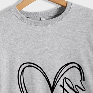 Light gray crewneck sweatshirt for women featuring minimalist black heart line graphic