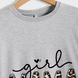 Women's grey crewneck sweatshirt featuring girl mama leopard print lettering on a hanger