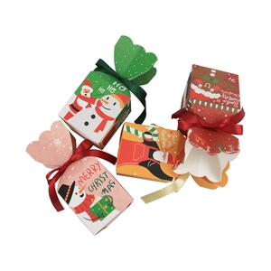 Colorful Christmas gift boxes with ribbons featuring Santa, Snowman and Gingerbread patterns