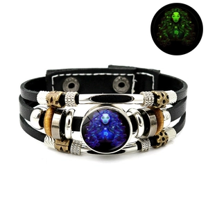 Detailed view of Virgo luminous leather bracelet showing night glow effect and layered design
