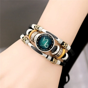 Close-up of multilayer leather zodiac bracelet with Capricorn sign and wooden beads