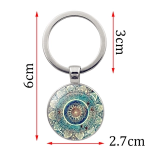 Mandala art pendant keychain in silver alloy with 6cm length and 2.7cm circular charm