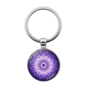 Macro view of purple yoga mandala glass pendant keychain with silver metal alloy ring