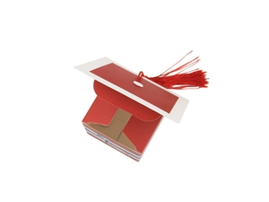 Detail of red graduation cap candy box with tassel on minimalist white background
