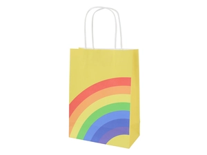 Detailed side view of yellow kraft paper gift bag with rainbow pattern and white handles