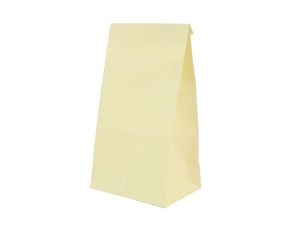 Macro detail of plain greaseproof kraft paper food bag showing bottom and side gussets