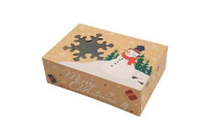 Macro view of Christmas kraft paper gift box featuring snowflake window and snowman design