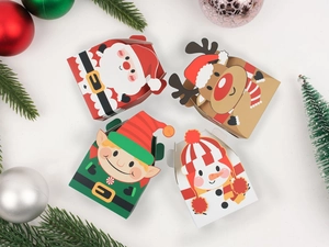 Detailed view of four festive Christmas paper gift boxes featuring Santa and reindeer designs