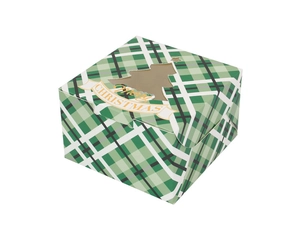 Macro view of Christmas gift box featuring green plaid pattern and tree-shaped window