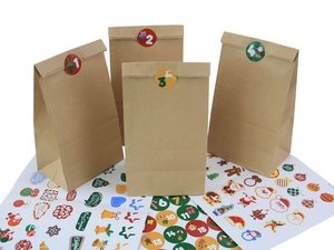 Detail of Christmas advent calendar brown paper bags with numbered holiday stickers
