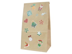Detail of a brown kraft paper gift bag with festive Christmas stickers and reindeer prints