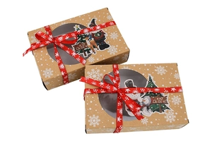 Detail view of Kraft paper Christmas cookie boxes with clear PVC windows and festive ribbons