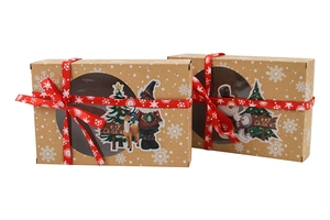 Detail of kraft paper Christmas gift boxes with round windows and festive stickers