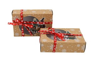 Detail of kraft paper Christmas gift boxes with transparent window and red ribbon