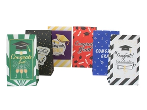 Detailed view of graduation paper gift bags with Congrats Grad prints and mortarboard icons
