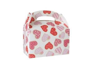 Detail of Valentine's paper gift box with red and pink heart patterns and curved handle