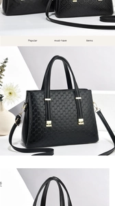 Détail d'un sac à main en cuir noir gaufré avec ferrures dorées et bandoulière amovible