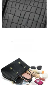 Vue détaillée du sac à main noir motif crocodile à grande capacité et finitions dorées