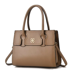 Detailed view of brown lychee texture handbag featuring a golden butterfly clasp