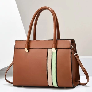 Detail of caramel leather tote with beige and mint green stripes and gold hardware
