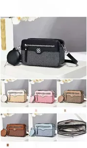 Detail showing macaron crossbody bag dimensions 20x8x12cm with round coin purse attachment