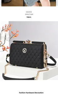 Close-up of quilted black evening bag featuring gold metal frame and gem-shaped clasp