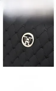 Detail of black quilted heart stitching pattern and gold metal logo on a handbag