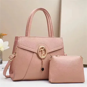 Fashionable dusty pink leather tote bag set with gold T-clasp and matching pouch