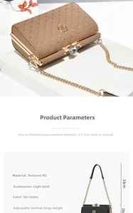 Detail of embroidered heart quilted crossbody bag with gold logo and crystal clasp