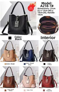 Detail view of multi-layer stone pattern bucket bag showing seven colors and interior pockets