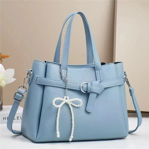 Light blue patchwork tote bag with pearl bow pendant and detachable shoulder strap
