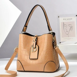 Khaki crocodile pattern bucket bag with golden D-shaped charm and adjustable strap