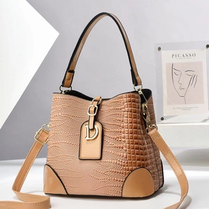 Brown crocodile pattern bucket bag with adjustable strap and metallic D-ring buckle