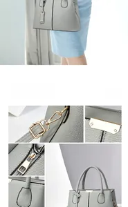 Detail view of light grey lychee pattern leather tote with golden hardware and handles