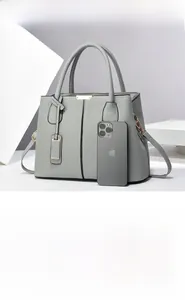 Large gray leather tote bag detail showing high capacity storage for daily essentials