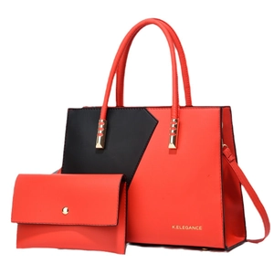 Two-piece red and black patchwork tote bag set with matching clutch and gold metal handles
