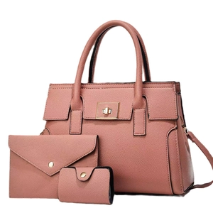 Three-piece purple faux leather tote bag set with envelope clutch and card holder