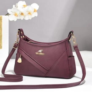 Elegant deep purple litchi grain leather underarm bag with gold hardware and V-shaped stitching